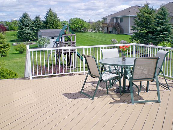 Huge deck overlooks backyard