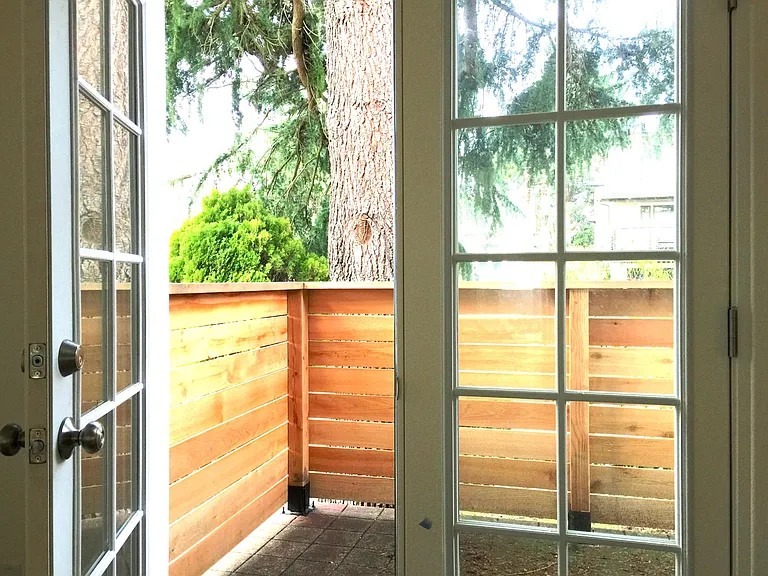 French doors lead out to private patio.