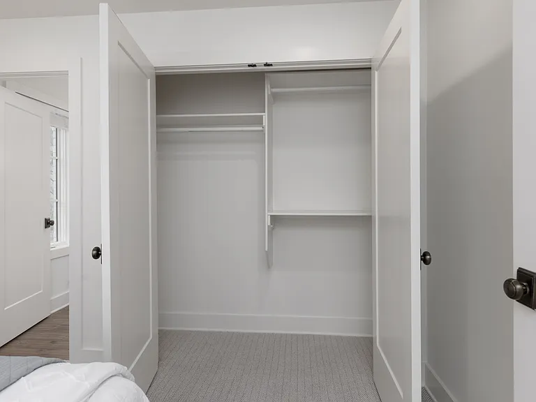 Bedroom 2 with a king bed and ensuite bath. Located on the 1st floor. Tastefully decorated with high-end modern furnishings and thoughtful touches to make your stay as comfortable as possible.