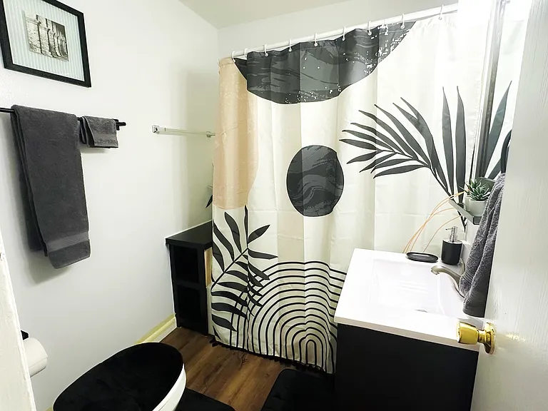 Bathroom with shower and vanity.