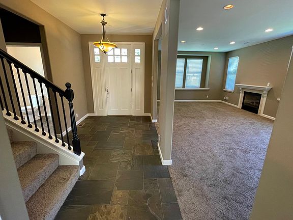 Entryway and living room and dining area