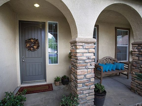Welcoming covered porch with arches
