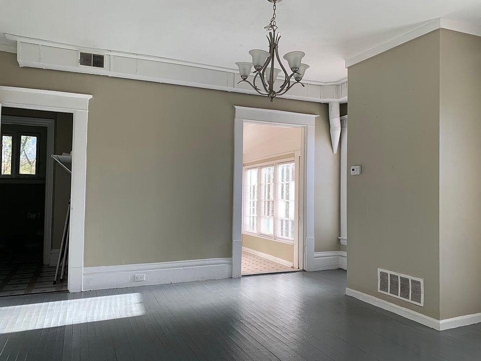View from the living room of the entrance to the kitchen on the right and entrance to the bathroom on the left