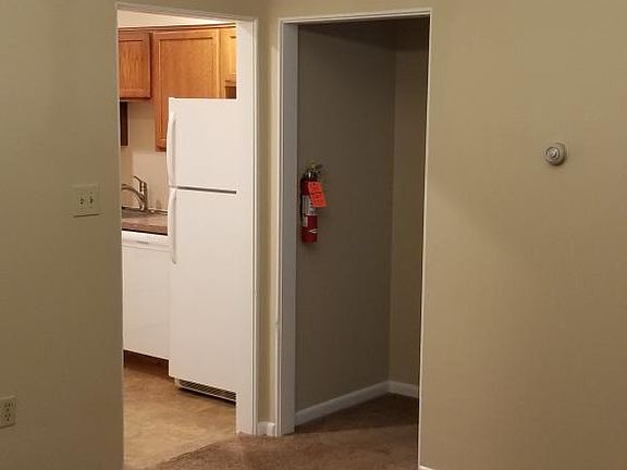 View from dining room looking into kitchen and hallway