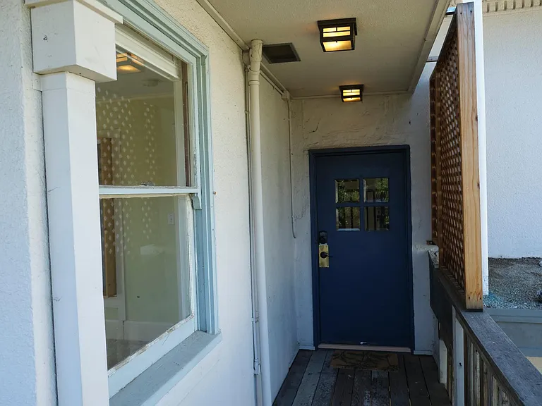 Upstairs entry way is sheltered from the elements.
