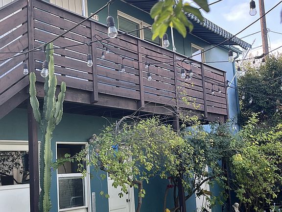 Upstairs apartment with small balcony