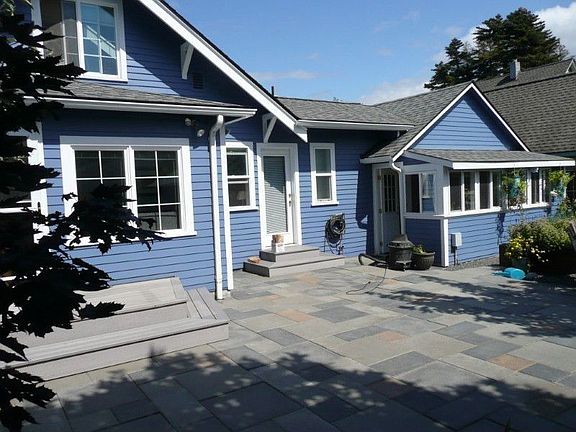 This is the view of the back of the house which faces south. Note the paver stone patio. The family 