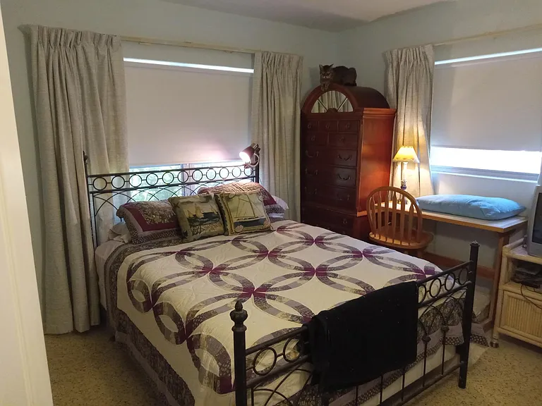 Seen with Queen size bed for size reference. (Bed not included in rental, but antique dresser is.)
