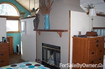 Attic Master Suite
						:
						Wood burning fireplace with propane starter. Lots of light