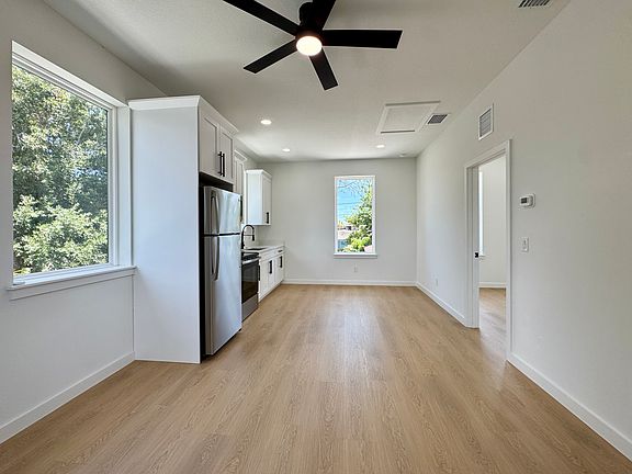Open kitchen and living space with ample natural light.