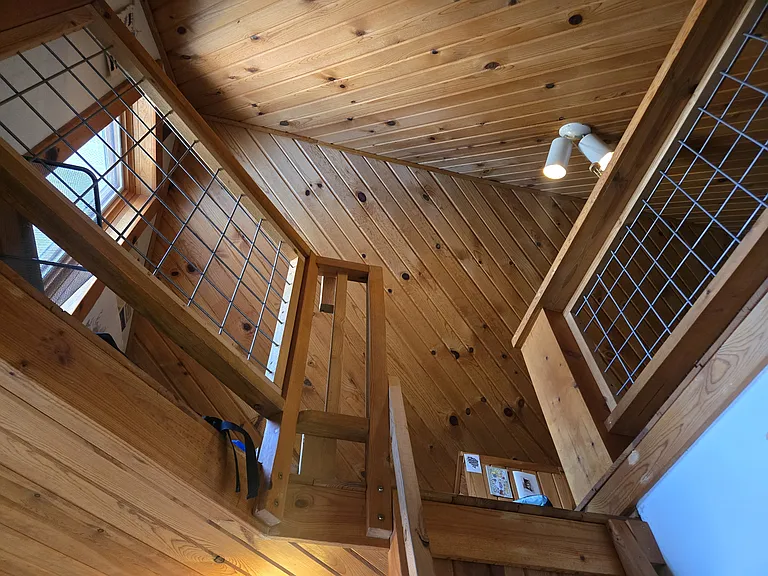 View of entry to the loft which is a perfect hangout space and fits a queen bed and has built in storage