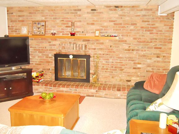 Full Wall Brick Hearth Fireplace