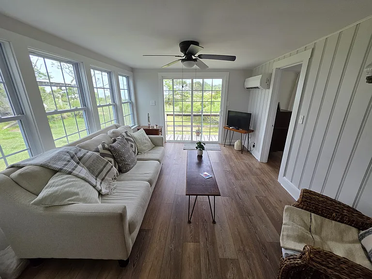 Living room has large windows and gorgeous water views