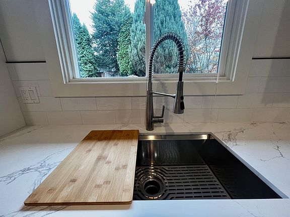 Kitchen Sink Overlooking Backyard.