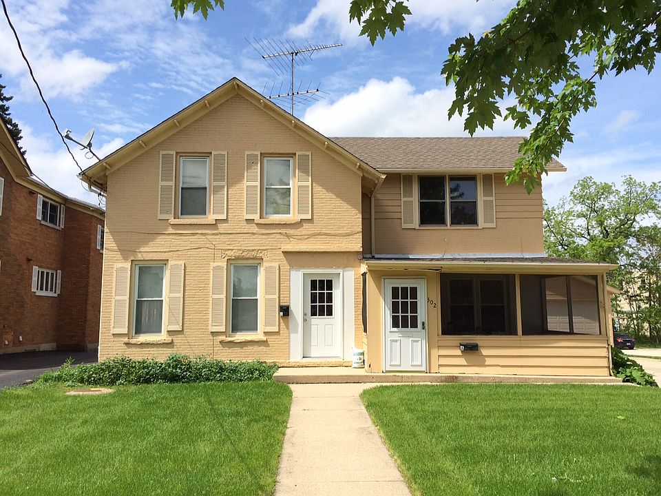 House view from the street. Entrance is the white door on th