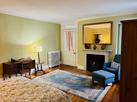 The large bedroom has a sitting are with working electric fireplace.