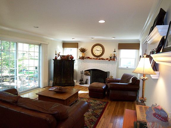 Family room overlooking large trees and private back yard