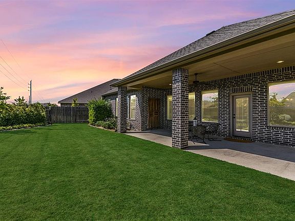 Large backyard with 26 foot long extended covered patio.