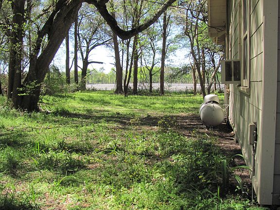 South Side Yard Showing Trees and Cow Pastures