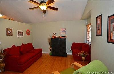 FORMAL LIVING ROOM WITH WOOD FLOORS