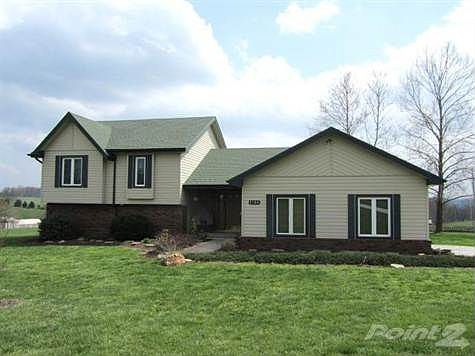 Mature trees and beautiful landscaping surrounds the home.
