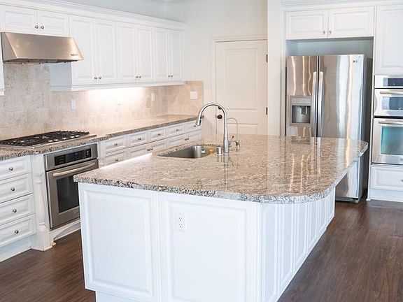 Fully upgraded kitchen with island, full backsplash, appliances included!
