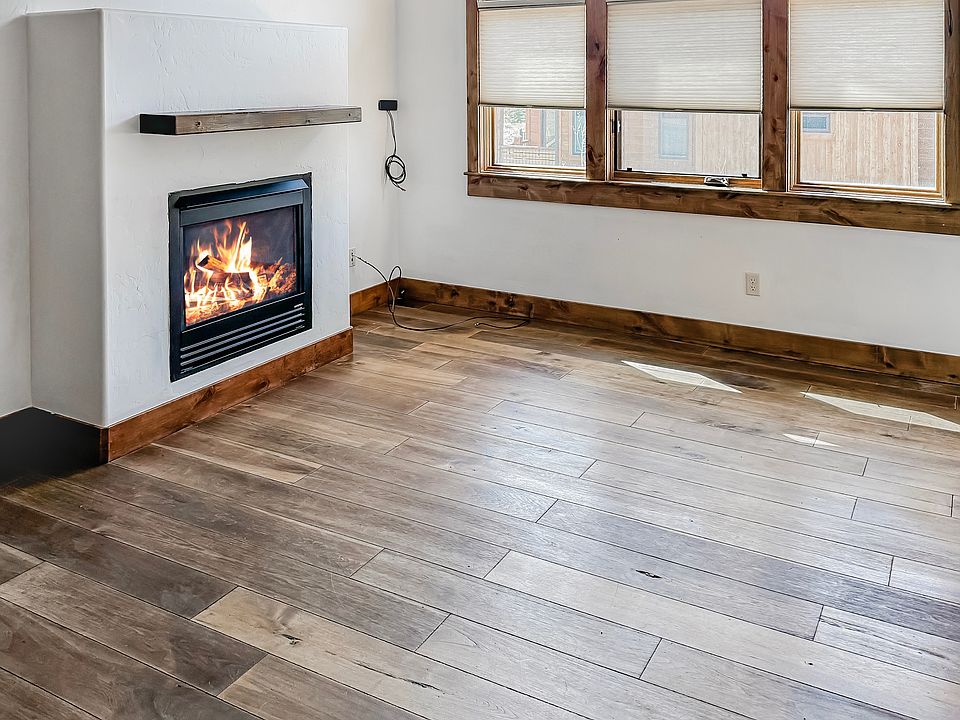 Gas fireplace, large windows with mountain views.