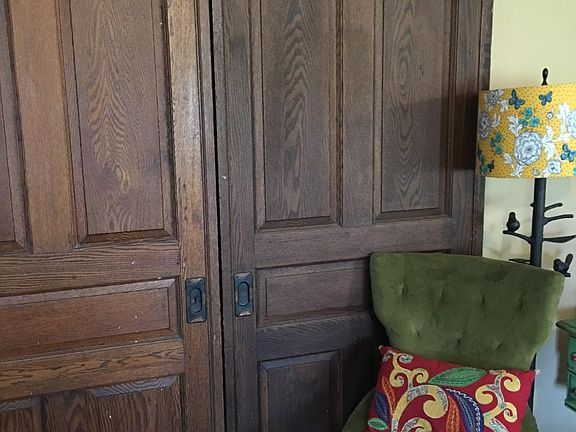 antique sliders between dining room and living room