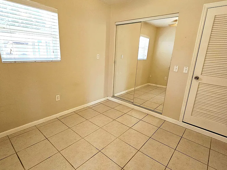Bedroom w storage closet