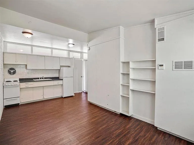 Kitchen and living room area in a unit.