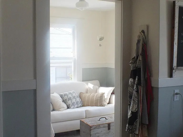 Little room off the kitchen shown with a sofa bed.