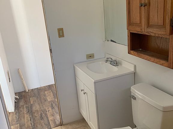 Bath with tile flooring and new vanity and toilet