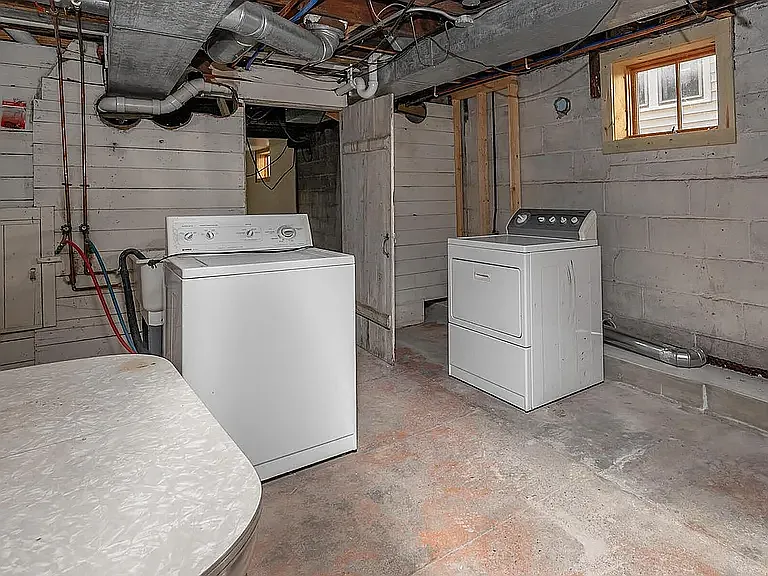 Separate washer and dryer with room for storage.