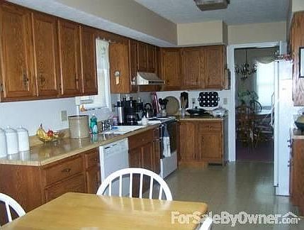 Kitchen with Lots of Oak Cabinets : Eat in area with door to dining room