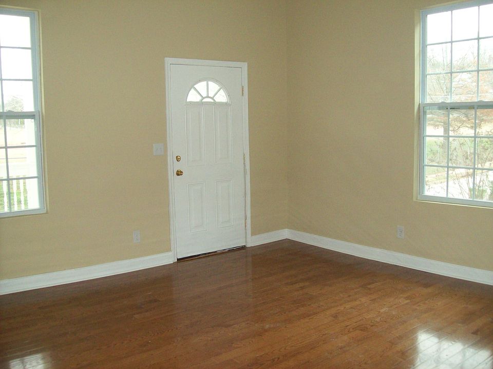 High ceilings and hardwood floors add to the charm of this sunny living room.