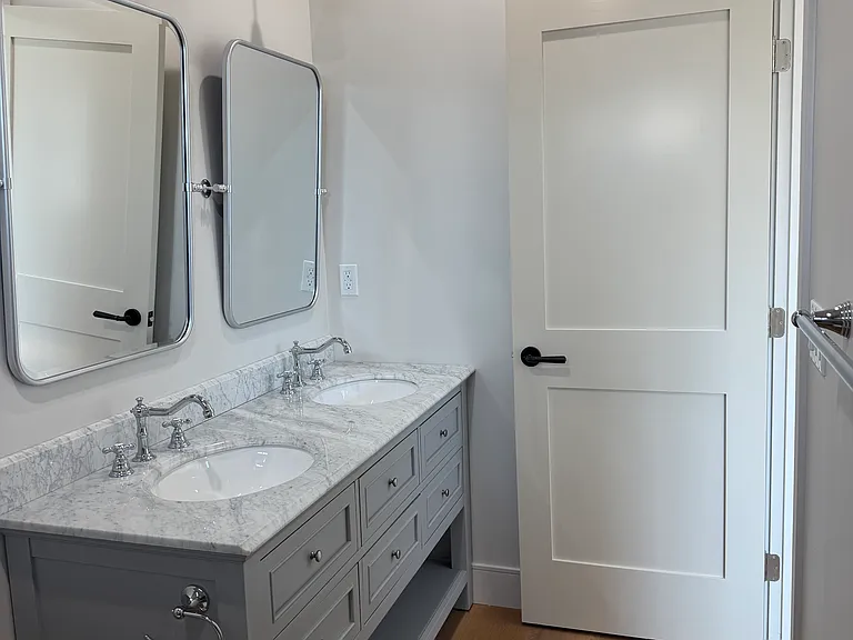 upstairs bathroom with dual sinks