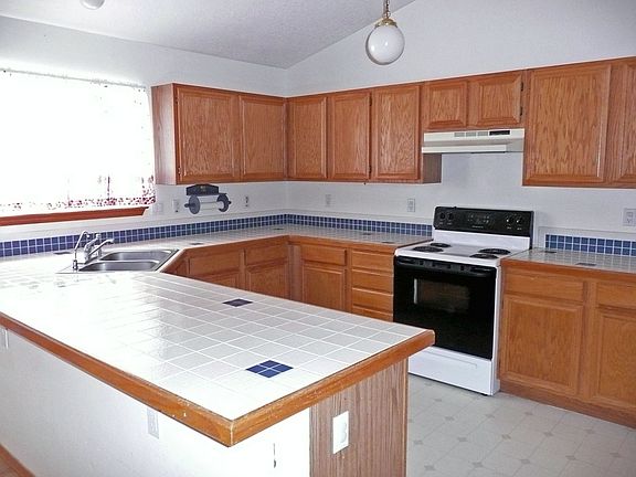 Kitchen with tiled counter tops