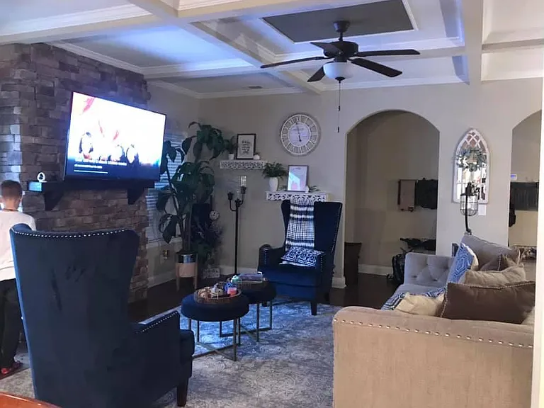 Living room. With fireplace. Open floor plan into kitchen.