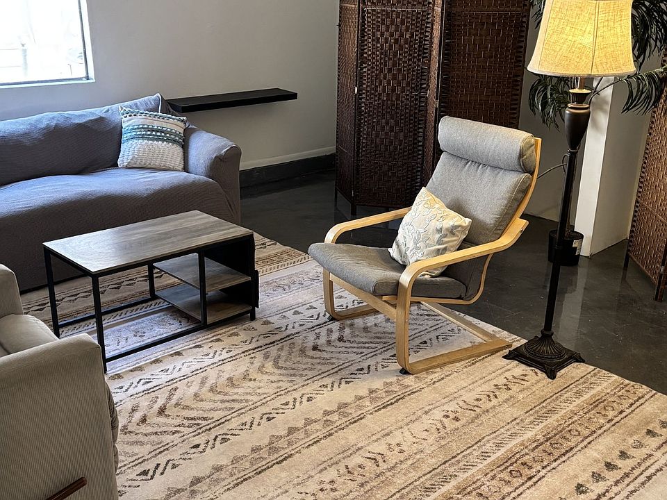 seating area with flat screen, couch, chair and recliner