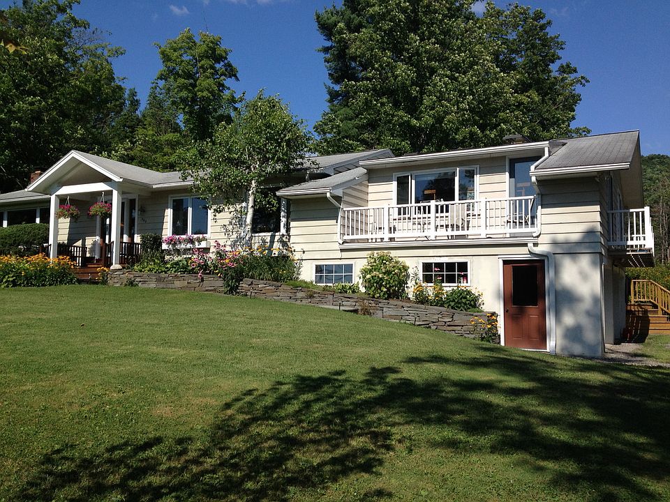 Front of house, includes two front porches.