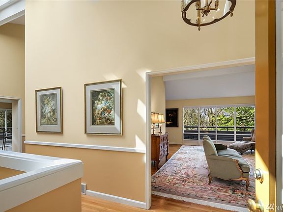 Hardwood floors and soaring ceilings greet you. 