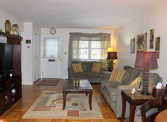 Main level entry leads to spacious living room, dining area and kitchen.