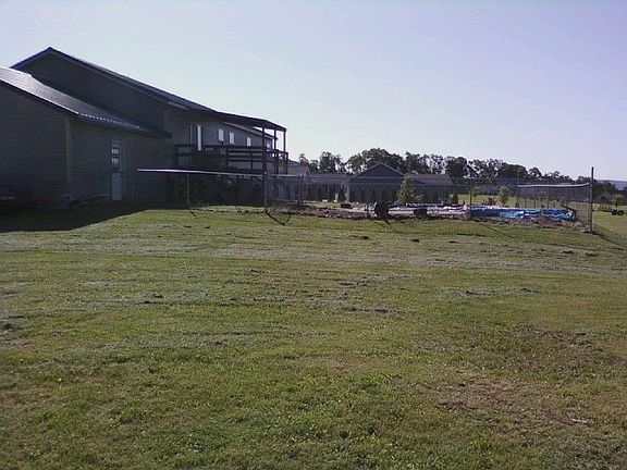 Part of the backyard showing the back deck and pool