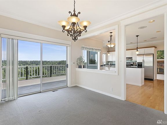 Formal dining room with deck access, perfect for entertaining