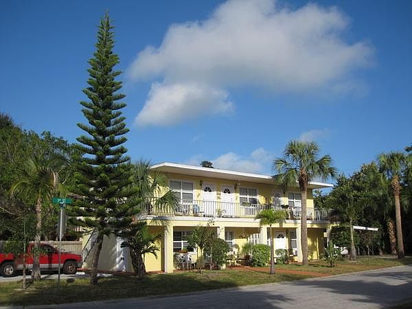 Front of 5-unit building. Private covered parking to far right (where white car is)