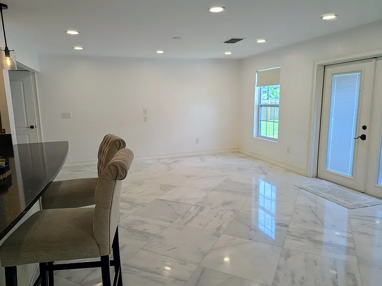 Second Family Room by the open kitchen, taken from breakfast nook. The wall has a hardwired network port for TV