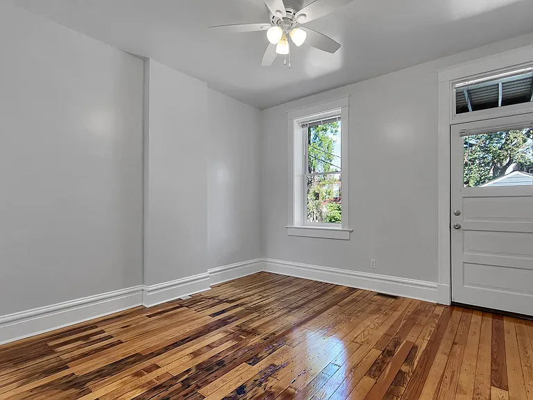 Bedroom 2 - salvaged hardwood floors, ceiling fan, venetian blinds, closet