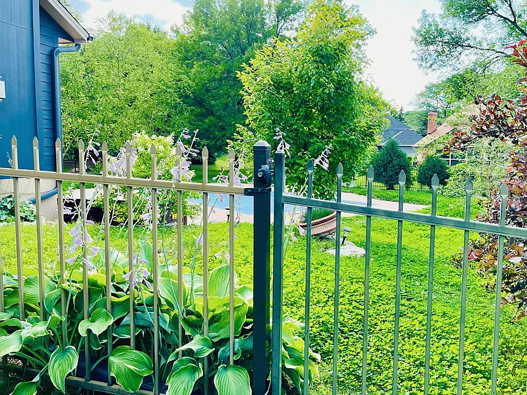 Fenced backyard with fantastic landscape and pool view.