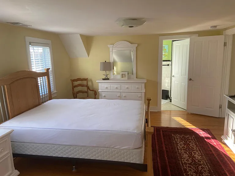 Guest bedroom, queen bed with private bath, no shower or tub.