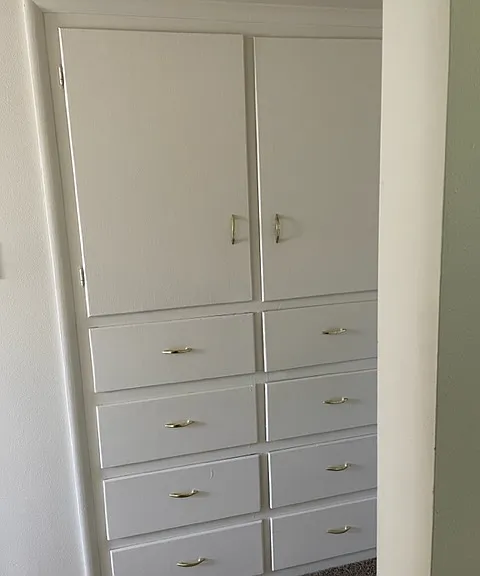 Hallway storage. Storage behind cabinet doors goes to the apt ceiling. Plenty of storage in both bedroom closets, as well.